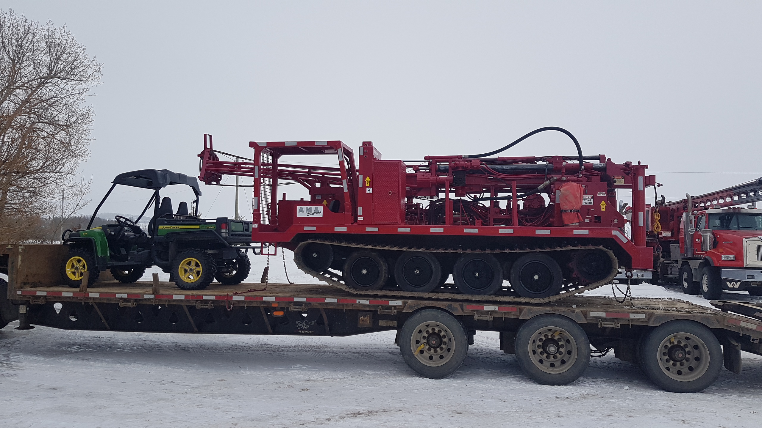 Drill on flatbed trailer