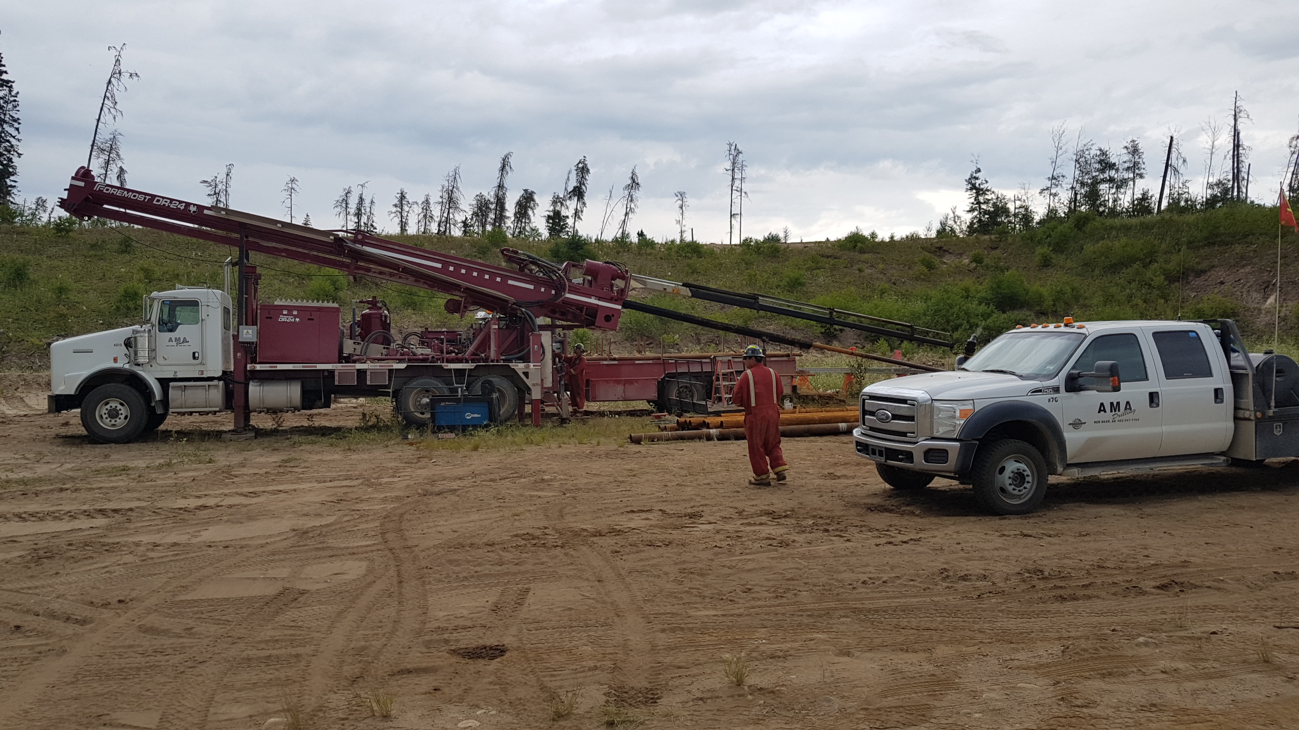 Drill and pickup with worker