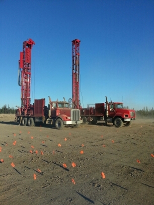 Two drilling trucks on site